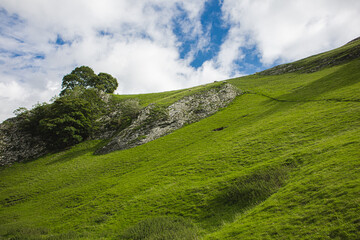 English countryside on a cloudy day. Green lush valley.