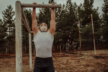 Fototapeta premium Man training with a mask due to the corona virus