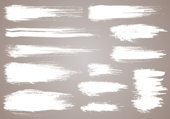 Paint brush. White ink grunge brush strokes. Vector paintbrush set. Grunge design elements. Painted ink stripes