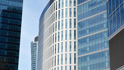 Obraz premium Bottom view of glass silhouette of skyscraper. Business building. Skyscraper with glass facade. Modern building in business district. Concepts of economics, financial, future. 