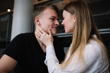 Naklejka premium Happy young couple preparing to kiss