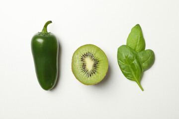 Fototapeta na wymiar Kiwi, spinach and pepper on white background