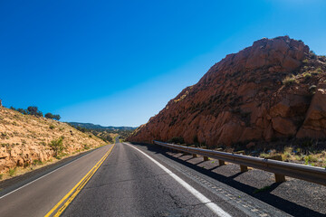 Road panorama on sunny summer day. Empty asphalt highway.
