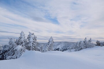 Beautiful winter mountain views during a snowshoe hike along the red ridge trail around Kosarisko in the Low Tatras
