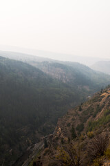 Fototapeta na wymiar Smoke filled mountains in Colorado during wildfire season. 