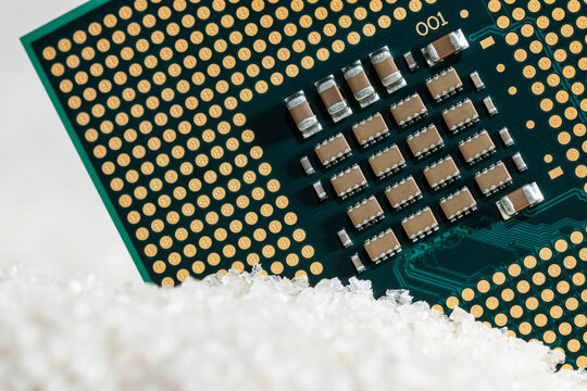 Close-up macro of a CPU unit processor on silica sand