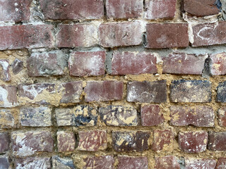 View on isolated old brick wall with cement