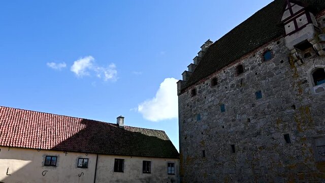 Clouds moving on the blue sky above the medieval keep of Glimmingehus, Sweden