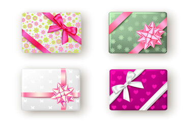 Pink, white and green gift box with ribbon and bow.