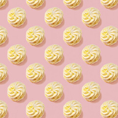 Seamless pattern of sweet yellow marsh-mallows  with one white marsh-mallow against pink backround. Soft light.