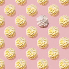 Seamless pattern of sweet yellow marsh-mallows  with one white marsh-mallow against pink backround. Soft light.