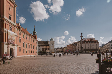 landscape from the square of the old town of Warsaw in Poland with the royal castle and tenement houses