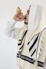 Orthodox Jewish man blast in Shofar, ram's horn, at Rosh Hashana holiday, jewish new year.