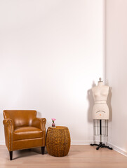 Home interior mock up portrait orientation. A cute leather chair with a bamboo end table and a...