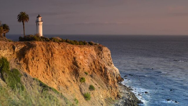 Lighthouse on top of cliffs by the Ocean at Sunset - Palm Tree in Southern California