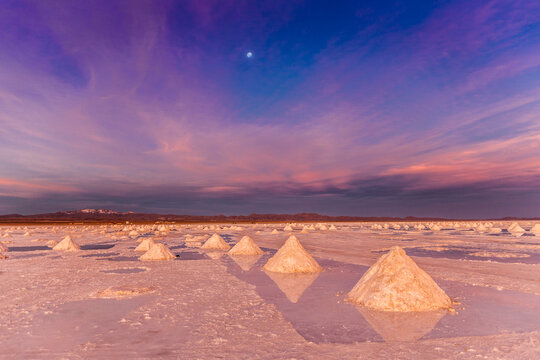 Salt stacks collected on salt flats at sunset, Salar de Uyuni, Southern Antiplano, Bolivia, South America