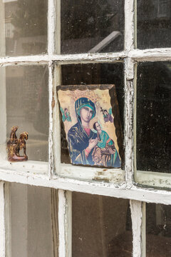Close up of religious icon in house window, Dingle, County Kerry, Ireland