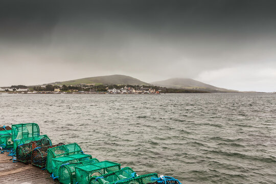 Lobster pots on harbor wall at Cahersiveen, County Kerry, Ireland