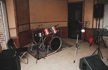 Empty music recording studio room with equipment
