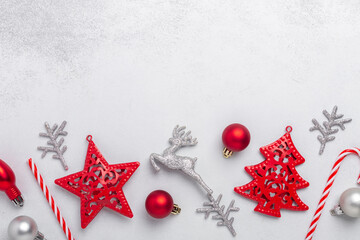 Christmas composition with red and silver gifts on stone background. Xmas holiday 2021 celebration. Flat lay, top view, copy space