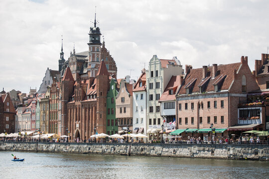 View of tourists on warehouse waterfront, Gdansk, Poland