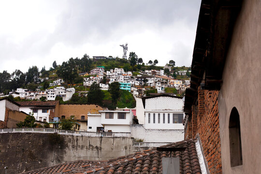 View of rooftops and Virgen de Quito on El Panecillo hill, Quito, Ecuador