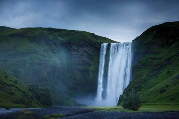 Skogafoss waterfall and grass covered mountains, Rangarvallasysla, Iceland © Image Source