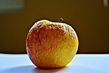 Rotten Fruit. Dried Apple with rotten, crumpled, and wilted skin