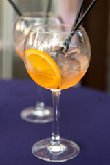 Cocktail glass with a slice of ripe orange