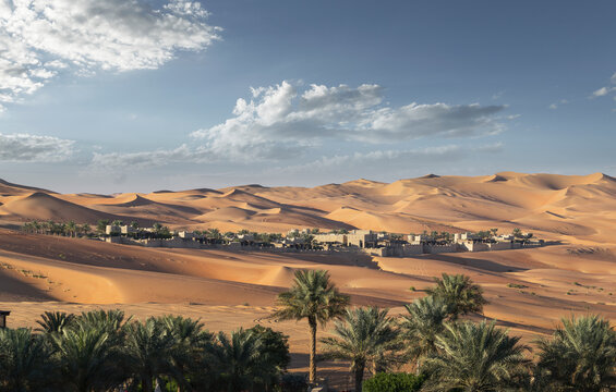 Distant view of Qsar Al Sarab desert resort among sand dunes, Empty Quarter Desert, Abu Dhabi, United Arab Emirate