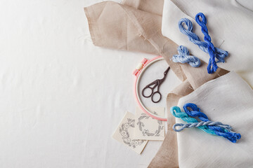 Embroidery set. Linen fabric, embroidery patterns, embroidery hoop, colorful threads and needls.
