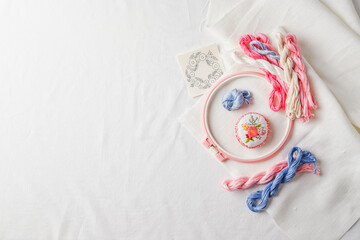 Embroidery set. Linen fabric, embroidery patterns, embroidery hoop, colorful threads and needls.