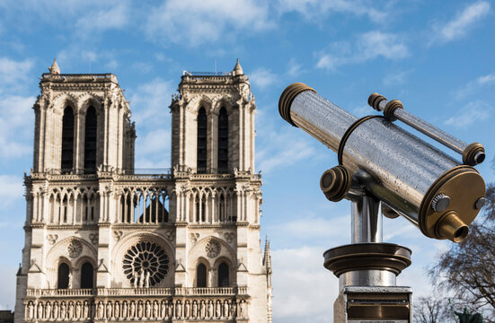 View of Notre Dame cathedral and coin operated telescope, Paris, France