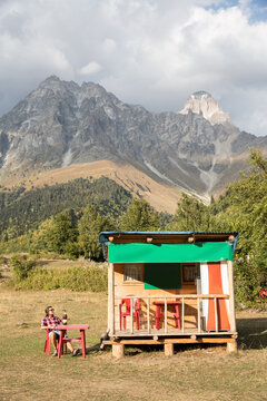 Man at isolated bar, Ushba, Svaneti, Georgia