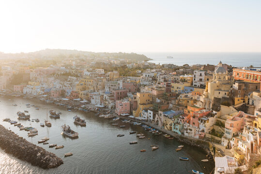 Elevated view of waterfront and buildings at dusk, Procida island, Campania, Italy