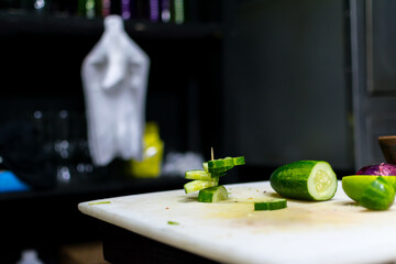 vegetable chopping board. decoration with cucumber. dark food