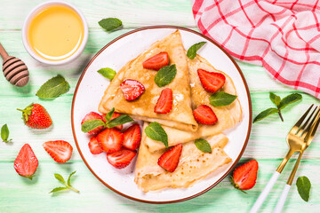 Crepes with fresh srawberries and honey.
