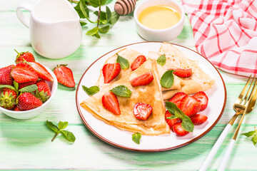 Crepes with fresh srawberries and honey.