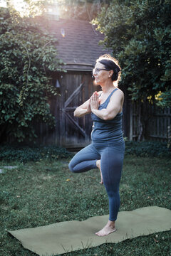 Senior Woman Doing Yoga Outdoors