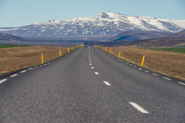 Road leading to a snowy mountain in Iceland.