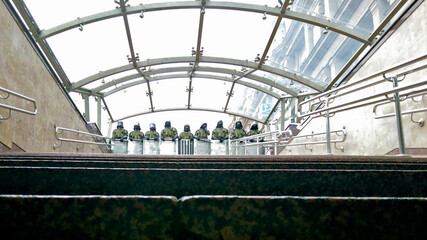 Belarusian law enforcement officers stand behind shields on the stairs in the underpass. Belarusian peaceful protest after presidential elections in Minsk, Belarus