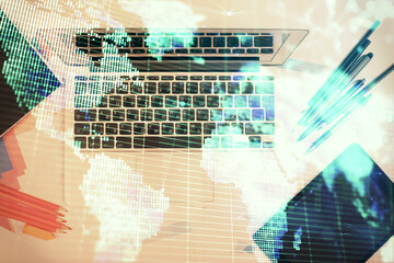 Business theme hologram drawings over computer on the desktop background. Top view. Multi exposure. Concept of international connections.