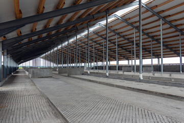 Metal frame of the building with a sandwich panel of insulation on the wall. Construction of a new industrial building. Modern Insulation of the walls of the building panels of insulation.