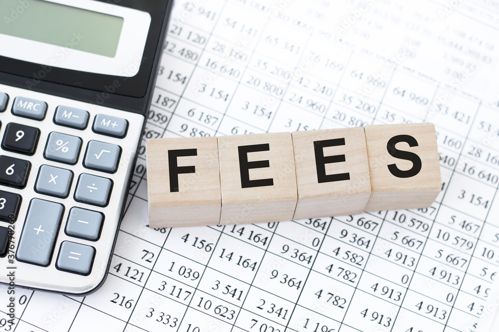 Poster fees .analysis target audience site or page on network. wooden cubes on the table next to the calcul
