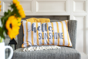 Cheerful throw pillow that says hello sunshine in stylish home interior