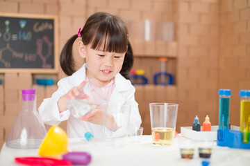 young girl  play science experiments for home schooling