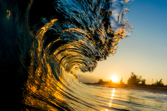 Close up of wave in sea during sunrise