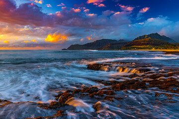 Scenic view of sea against cloudy sky during sunset