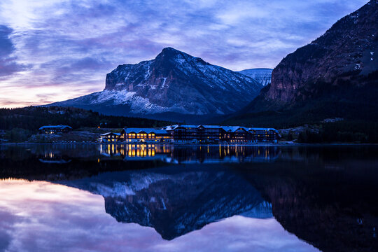 Scenic View Of Lodge In Glacier National Park At Dusk