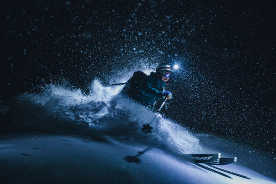 Woman skiing on snowy landscape